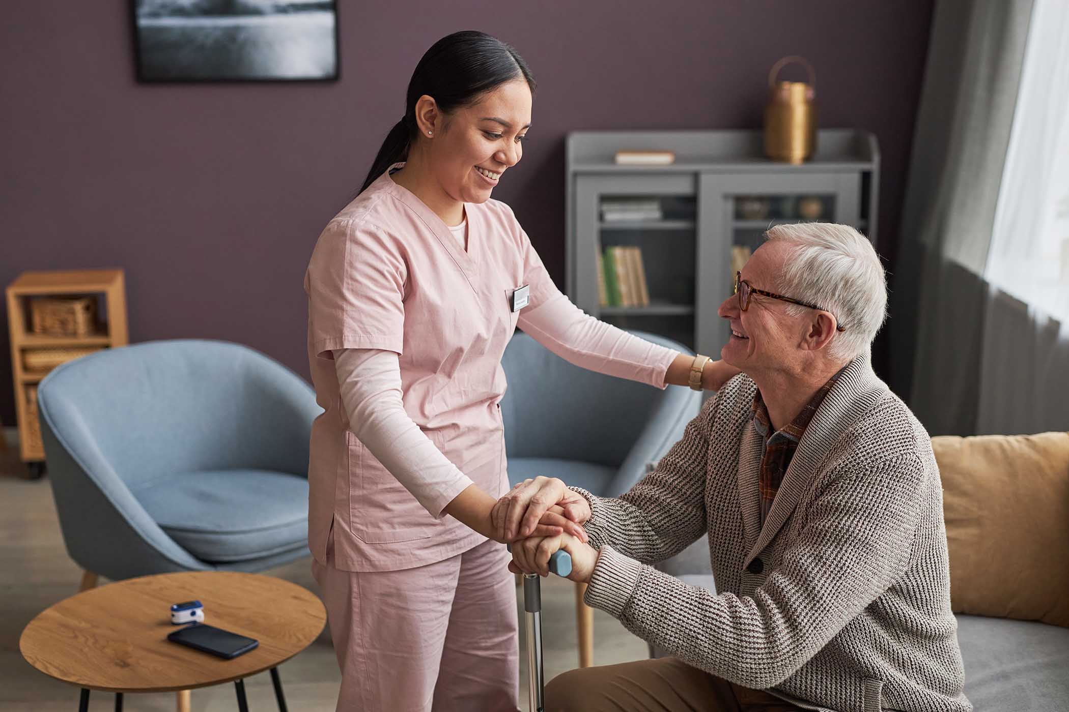 caregiver caring about senior man during rehabilit CKS.jpg