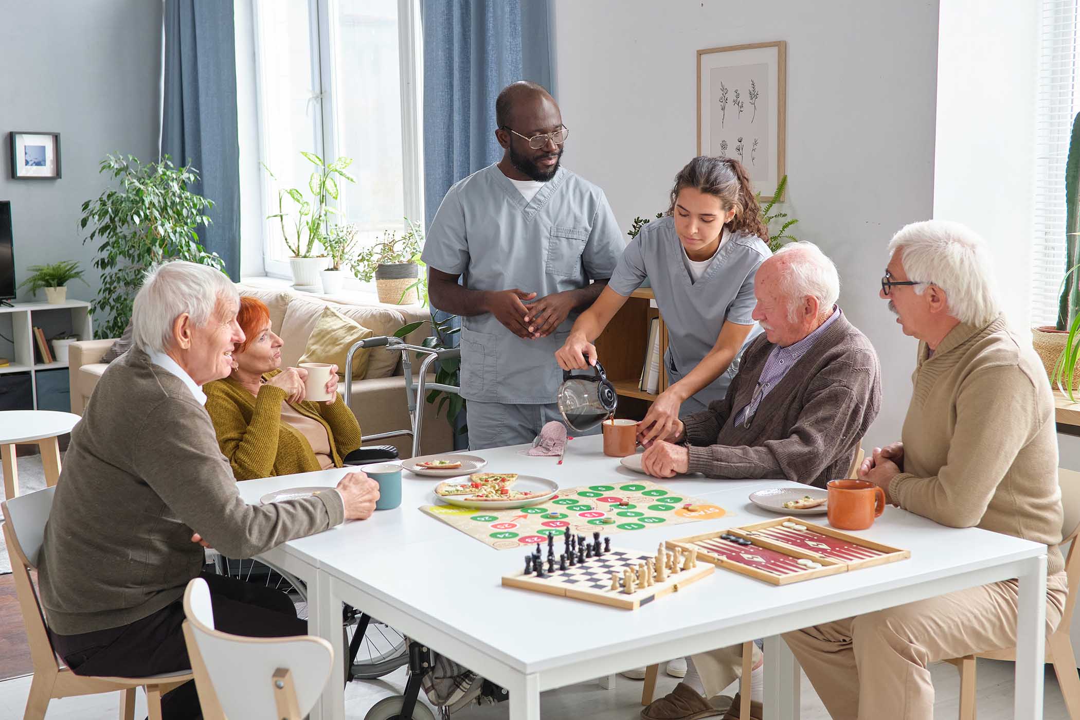 nurse caring about senior people in nursing home WKUEJ.jpg